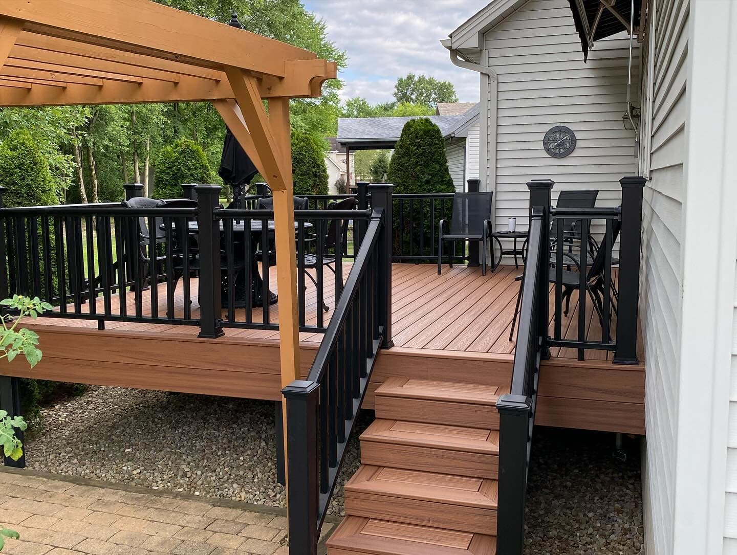 Composite deck with pergola overlooking backyard