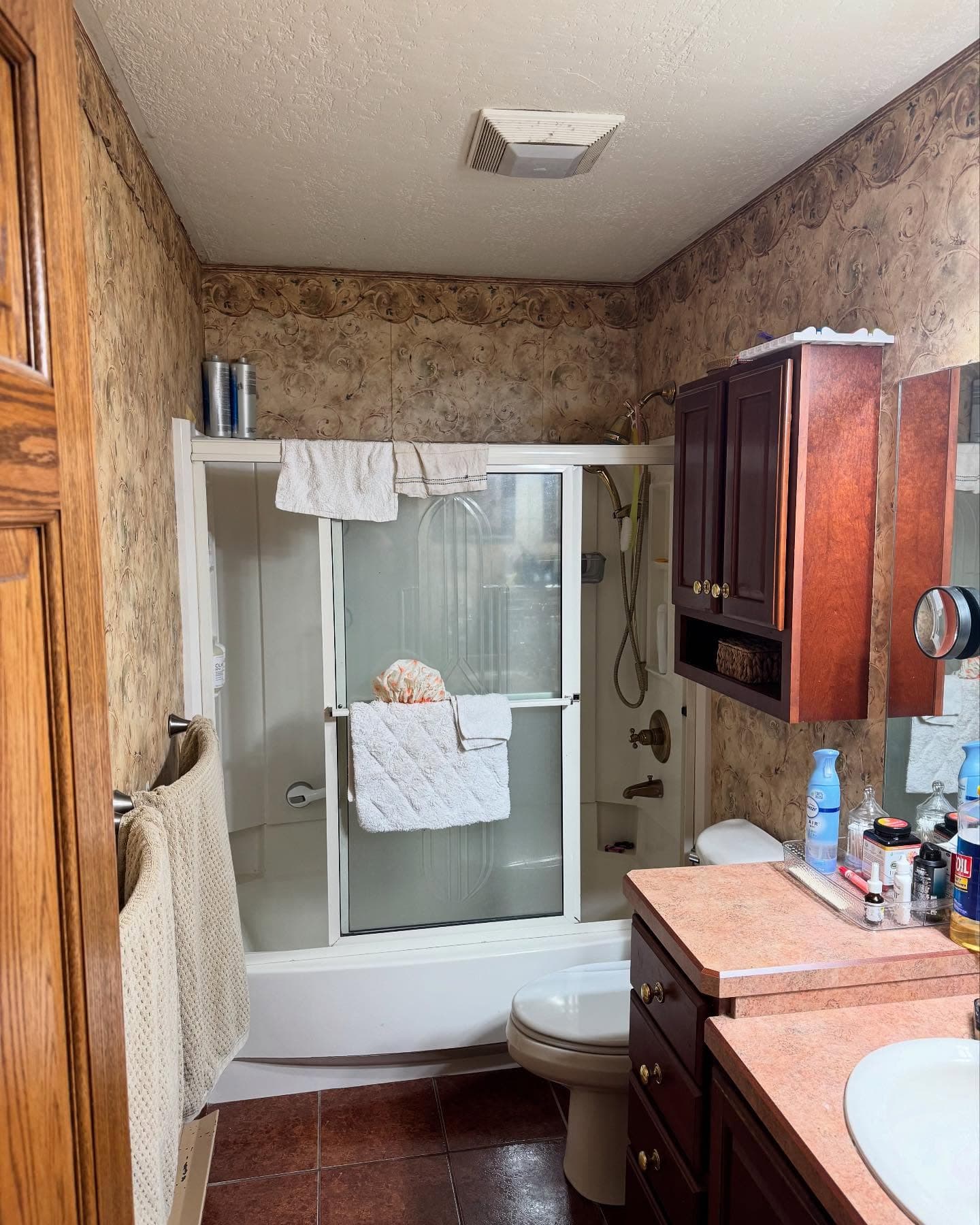 Marble subway tile shower with sliding glass door